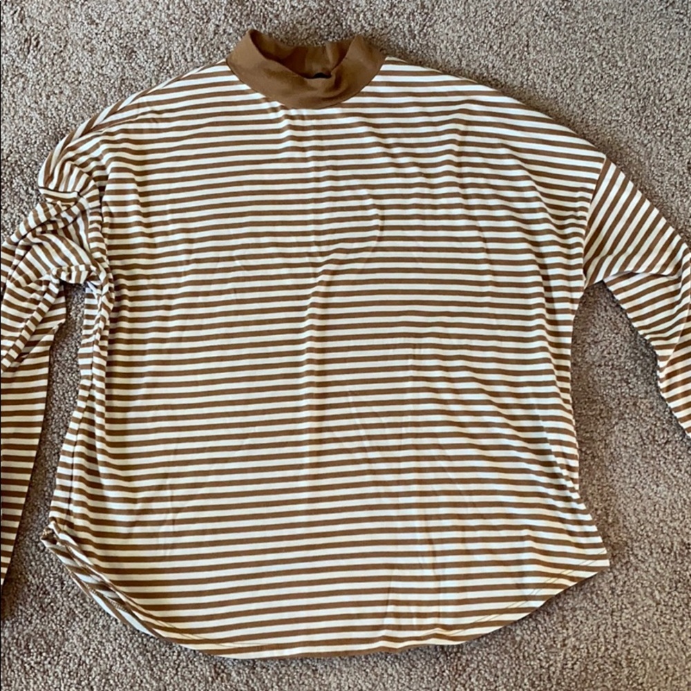 Cream and brown striped top.
